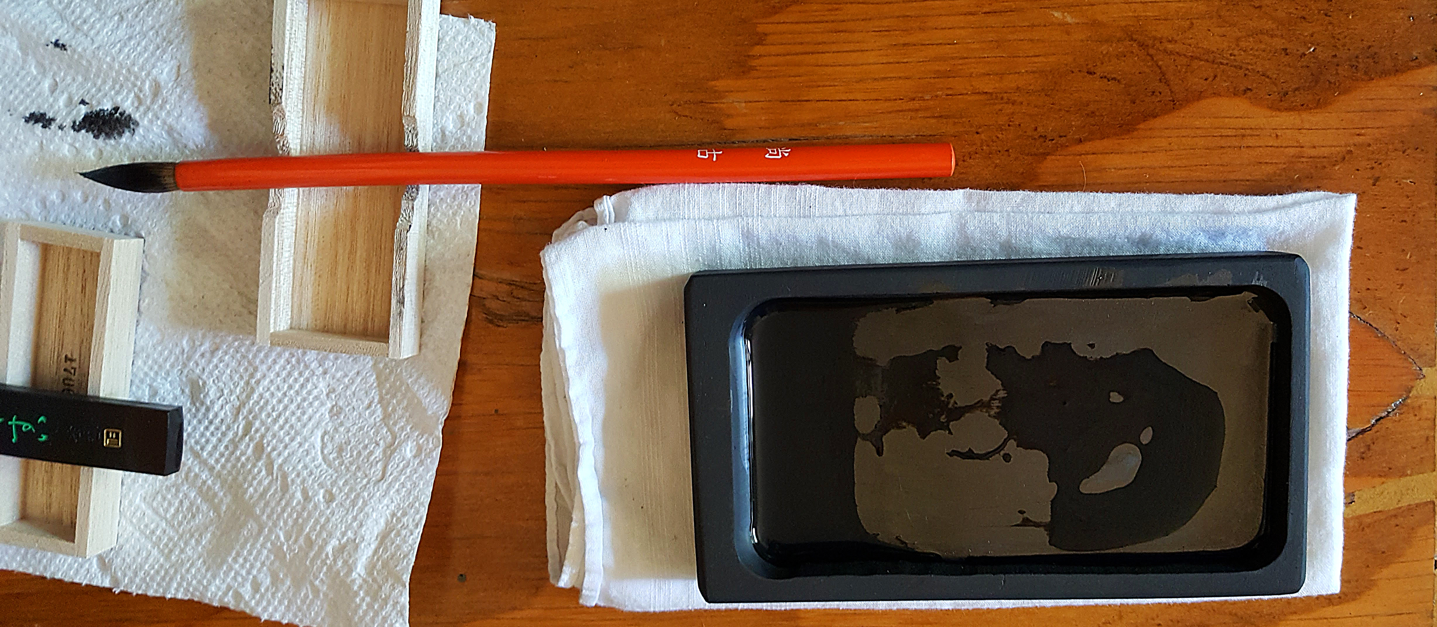 Sumi-e Japanese ink painting at home ink stone and brush