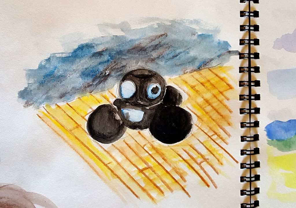 Maker Faire robot black with blue circles on its head rolling on a wooden floor